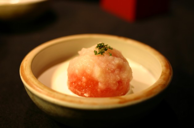 Whole Tomato Whole Tomato with potato sause and melted cheese in a bowl.