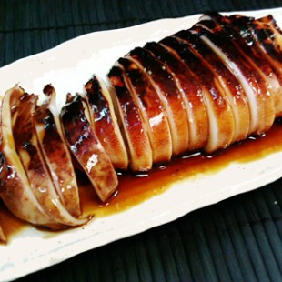 Whole squid with "Tare" the Yakitori sause on the dish.