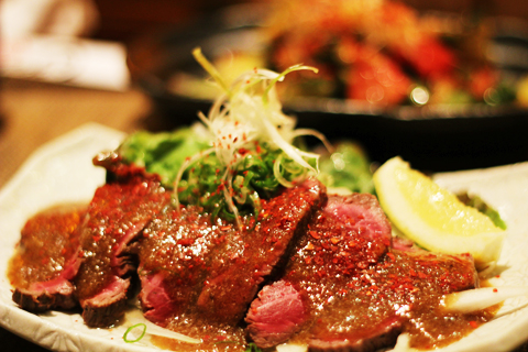 Kobe beef carpaccio Kobe beef carpaccio with special sause on the dish.