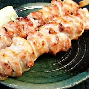 2 sticks of Chiken thigh on the dish.