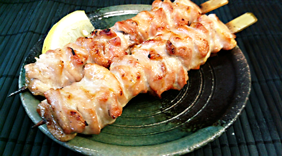 Chicken thigh 2 sticks of Chiken thigh on the dish.