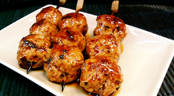 Torihei's original meat ball 3 Sticks of meatballs on the dish.