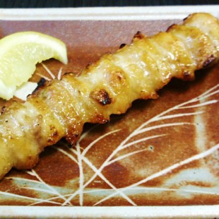 Chicken Tail on the dish with a piece of lemon